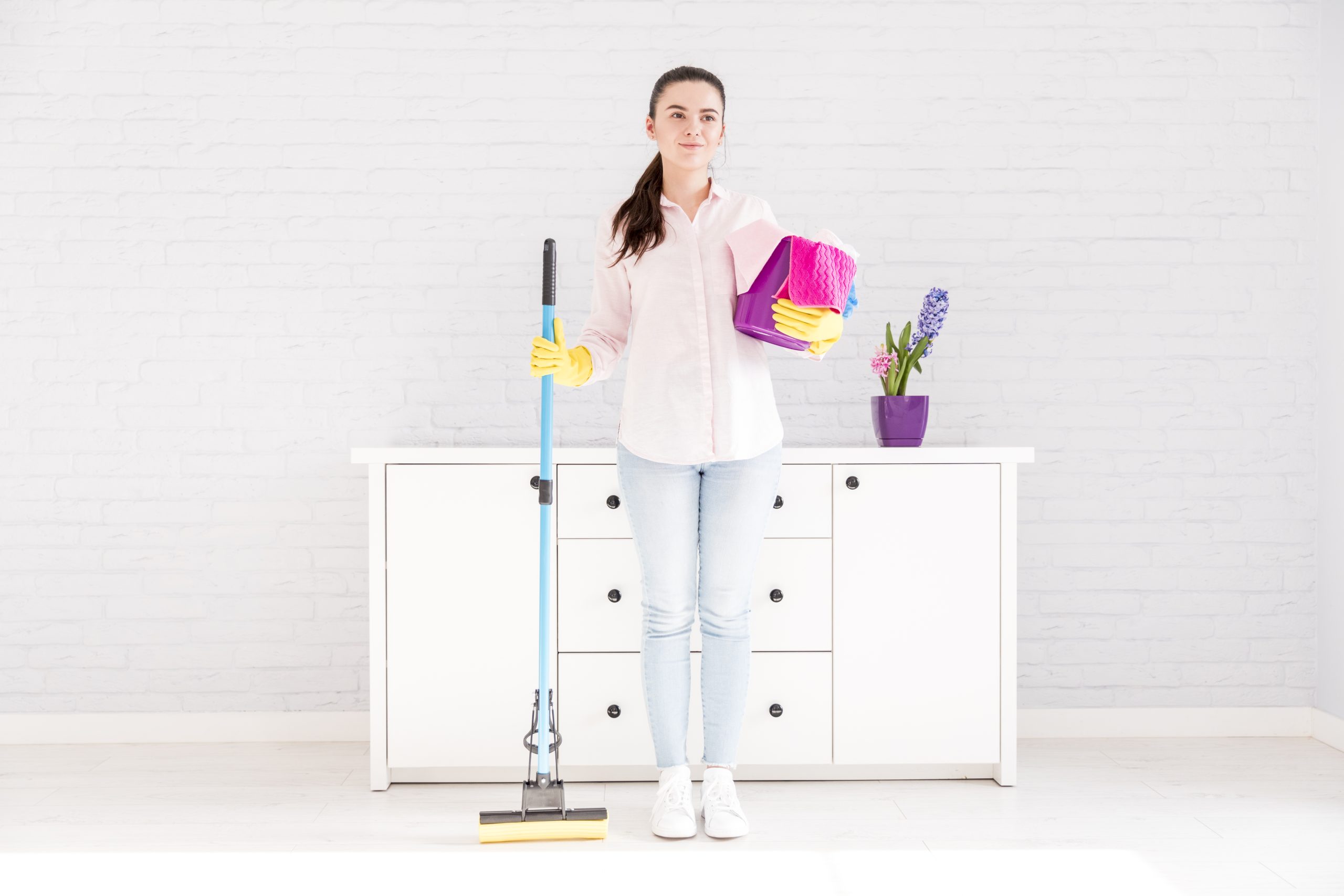 woman-cleaning-her-home (4) The Essential Guide to Wall Cleaning for a Cleaner, Healthier Home